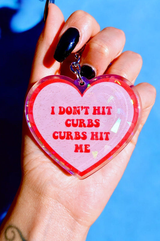 I Don't Hit Curbs Curbs Hit Me Holographic Heart Keychain